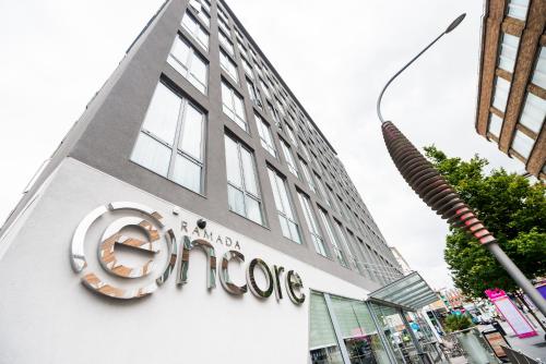 a store sign on the side of a building at Ramada Encore Leicester City Centre in Leicester