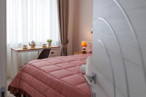 Postel nebo postele na pokoji v ubytování REDDIMUS Guest House