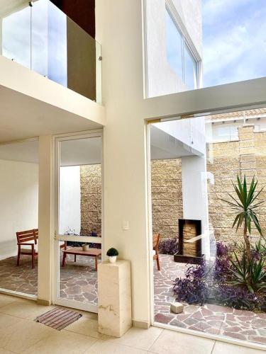 a living room with a fireplace in a house at Cekalli in León