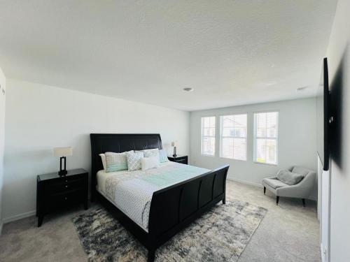 a bedroom with a large bed and a chair at Davenport 1 in Davenport