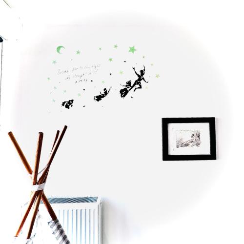 a room with a vase with butterflies on the wall at Cosy Apartment Carré Elysée Serris in Serris