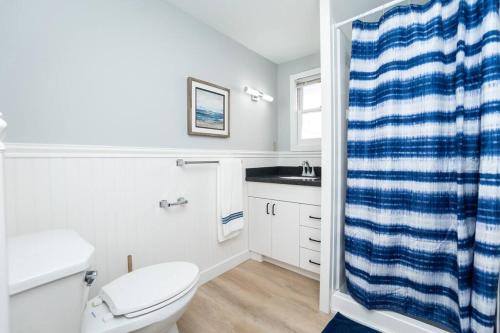 a bathroom with a toilet and a sink at Hampton Beach Seaside Villa Unit 2 in Hampton