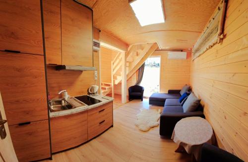 a living room with a sink in a tiny house at ECO Domek z dużym ogrodem i widokiem in Murzasichle