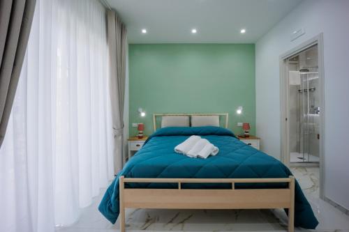 Postel nebo postele na pokoji v ubytování REDDIMUS Guest House