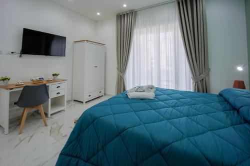 Postel nebo postele na pokoji v ubytování REDDIMUS Guest House