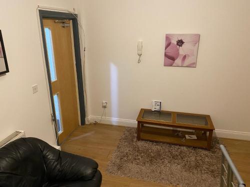 a living room with a couch and a coffee table at Single Room in CV1 Fargo Village Room with Shared bathroom in Coventry