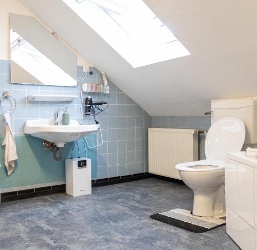a bathroom with a toilet and a sink at Superior 3 rooms, 4-8 guests, modern, Full equipped in Duisburg