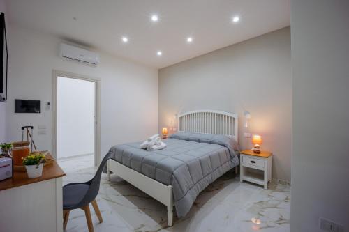 Postel nebo postele na pokoji v ubytování REDDIMUS Guest House