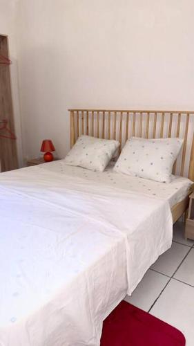 Postel nebo postele na pokoji v ubytování Calme et sérénité au Lamentin