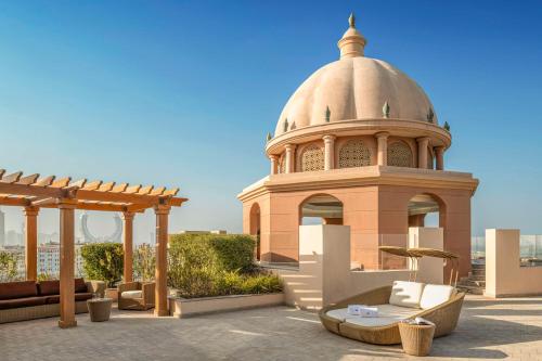 a gazebo on the roof of a building at Marsa Malaz Kempinski, The Pearl in Doha