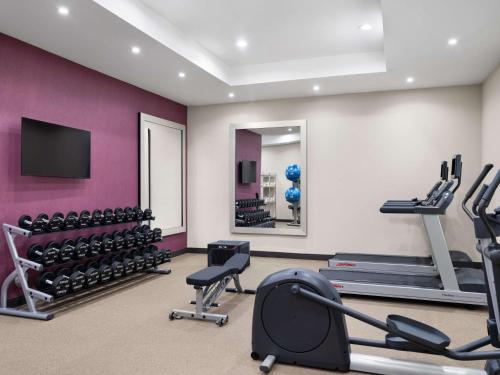 a gym with exercise equipment and a mirror at Home2 Suites By Hilton Round Rock Medical Center in Round Rock