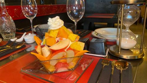 a glass bowl of fruit on a table at Hotel Black Boutique in Mexico City