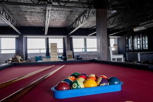 a pool table with a bunch of balls on it at Hotel Black Boutique in Mexico City