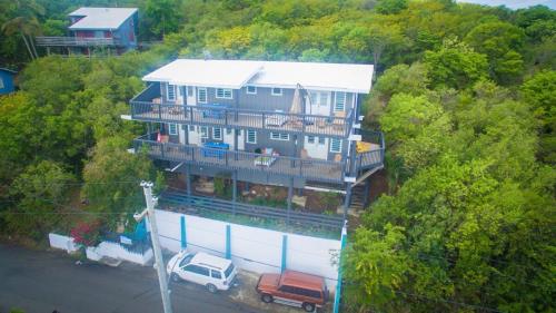 a large house with a truck parked in front of it at Ocean Front Villa 2 in Culebra