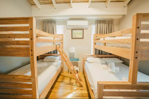 a room with two bunk beds in a house at Ocean Front Villa 1 in Culebra