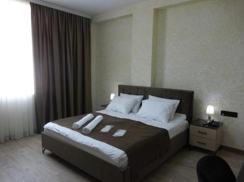 En eller flere senge i et værelse på Avrasya Hotel