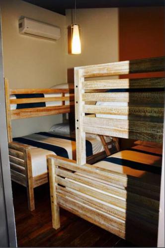 a room with two bunk beds in a room at Villa Tesoro at Carabali in Luquillo