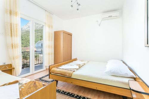 Postel nebo postele na pokoji v ubytování Apartment Podaca 2783c