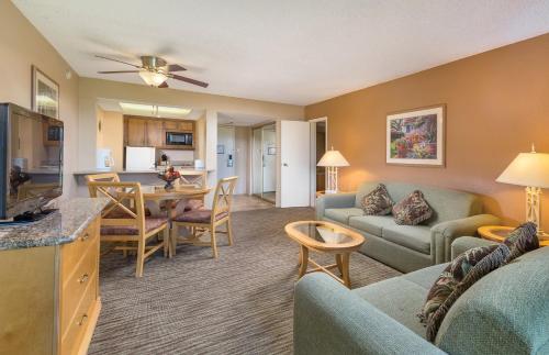 a living room with a couch and a dining room at WorldMark Palm Springs - Plaza Resort and Spa in Palm Springs