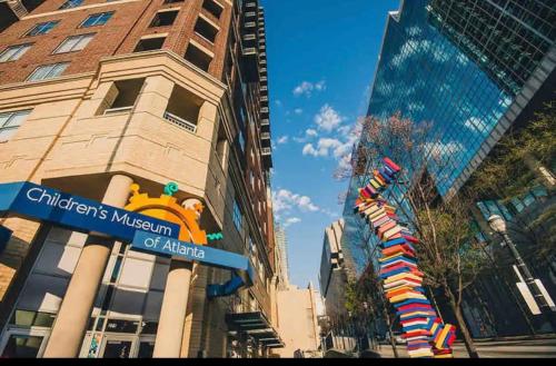 a city street with a street sign and a building at Heart of Atlanta in Atlanta