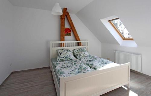 a white bed in a room with a window at 3 Bedroom Awesome Apartment In Zwiedorf in Zwiedorf