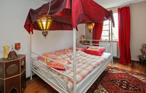 a bedroom with a bed with a canopy at Cozy Apartment In Kieve With Wifi in Kieve