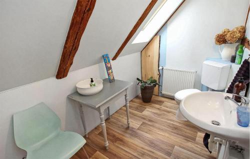 a bathroom with a sink and a mirror and a sink at Cozy Apartment In Kieve With Wifi in Kieve