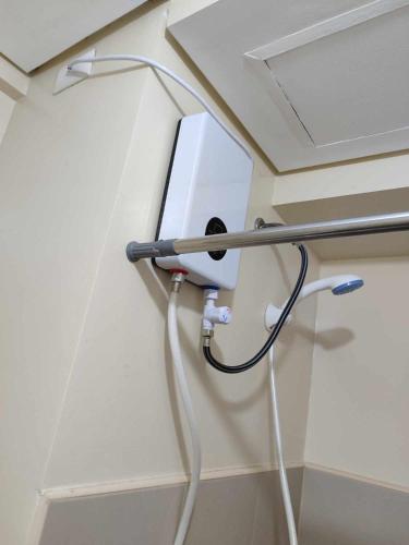a hospital room with a hair dryer on a wall at Atria T3 Unit 624 Pool View in Iloilo City