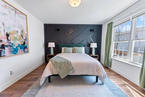 a bedroom with a bed and a large window at Dream! in Newark