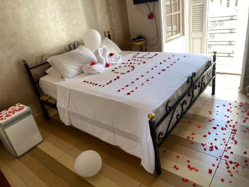a bedroom with a bed with balloons on it at Meramees Hotel in Cairo