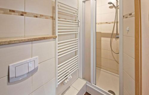 a bathroom with white cabinets and a shower at Awesome Apartment In Wesenberg With Wifi in Wesenberg