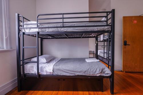 a couple of bunk beds in a room at YHA Hobart Central in Hobart