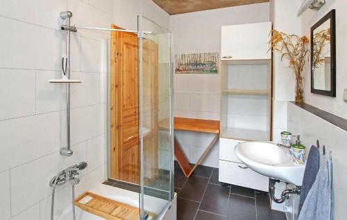 a bathroom with a glass shower and a sink at Gorgeous Apartment In Mirow With Wifi in Mirow