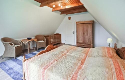 a bedroom with a large bed in a attic at 2 Bedroom Beautiful Home In Wokuhl-dabelow in Wokuhl