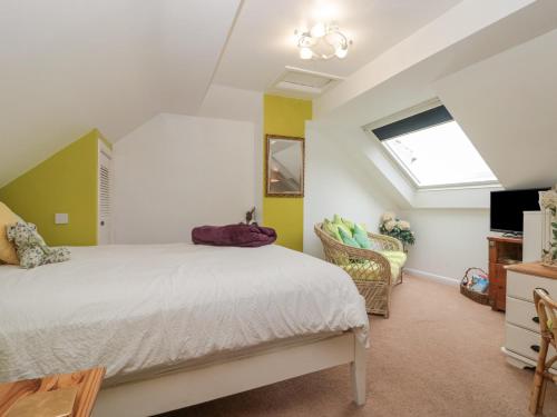 a bedroom with a bed and a window at Amari in Scarborough