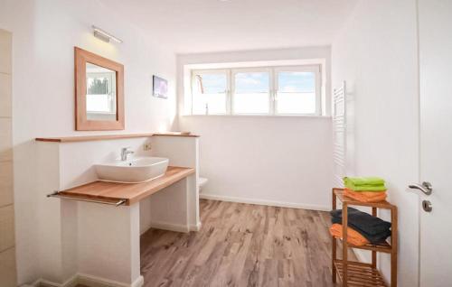 a white bathroom with a sink and a window at Awesome Apartment In Klink With Wifi in Klink