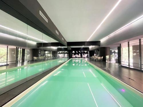a swimming pool with blue water in a building at Beguest Juarez Mrb&b Partner, King Size Gym in Mexico City