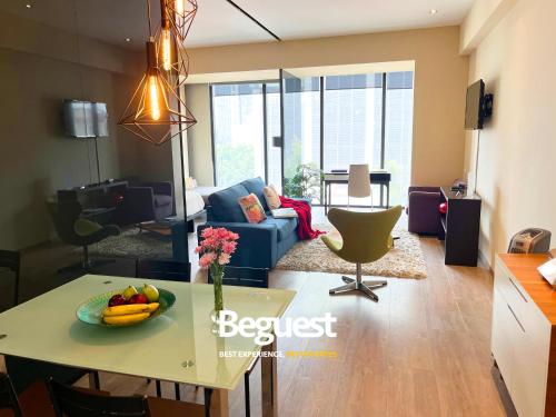 a living room with a table with a bowl of fruit on it at Beguest Juarez Mrb&b Partner, King Size Gym in Mexico City