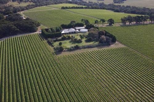 an aerial view of a farm house in a field at Vineyard Lane - Winery Escape in Balcombe