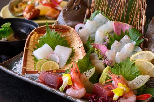 a tray of food with different types of sushi at Kaike Tsuruya in Yonago