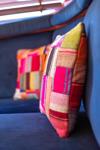 two pillows sitting on a seat on a bus at Bateau Le Nubian in Narbonne