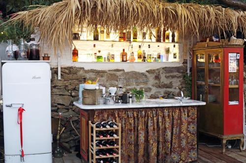 a kitchen with a counter and a refrigerator at Nisanyan Hotel in Selcuk