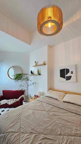 Ένα ή περισσότερα κρεβάτια σε δωμάτιο στο Urban Zen at Azure North Pampanga - Studio 416 NA
