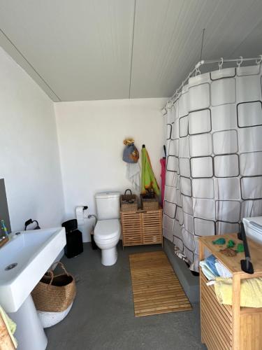 a bathroom with a sink and a toilet at Villa Elia in Néa Koróni