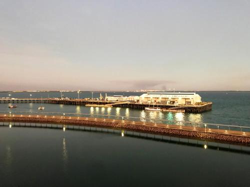 a pier on the water with boats in the water at Serenity Sea La Vie - 3brm Penthouse at Darwin Waterfront in Darwin