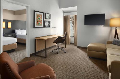 a hotel room with a desk and a bed at Residence Inn Irvine Spectrum in Irvine