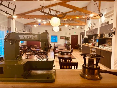 a sewing machine sitting on a table in a room at Ever Route 64 Brit Hotel Tarbes Ibos in Tarbes