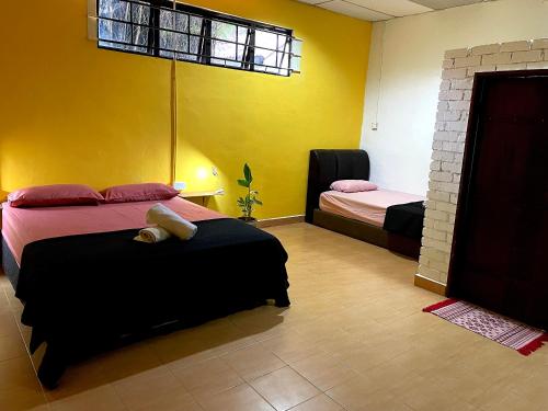 Ένα ή περισσότερα κρεβάτια σε δωμάτιο στο Home Sol Guesthouse