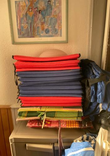 a stack of folded shirts sitting on top of a drawer at Villa Lakeview Paradise in Peštani