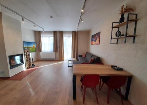 a living room with a couch and a table at Residence Budákov in Dolní Dvořiště